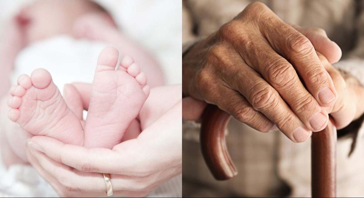 Pies de bebé recién nacido y mano de anciano