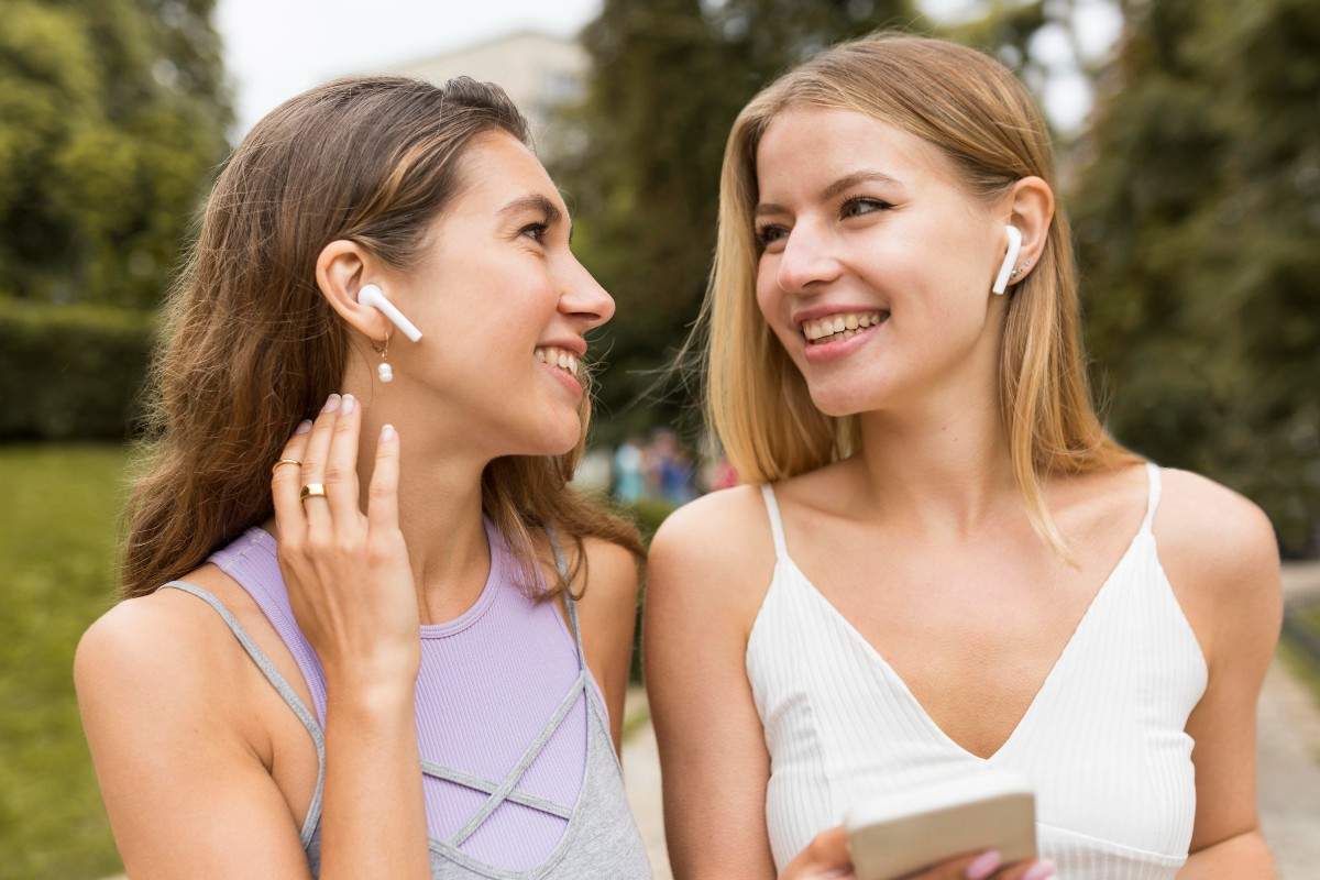 girls-wearing-airpods-in-the-park.jpeg