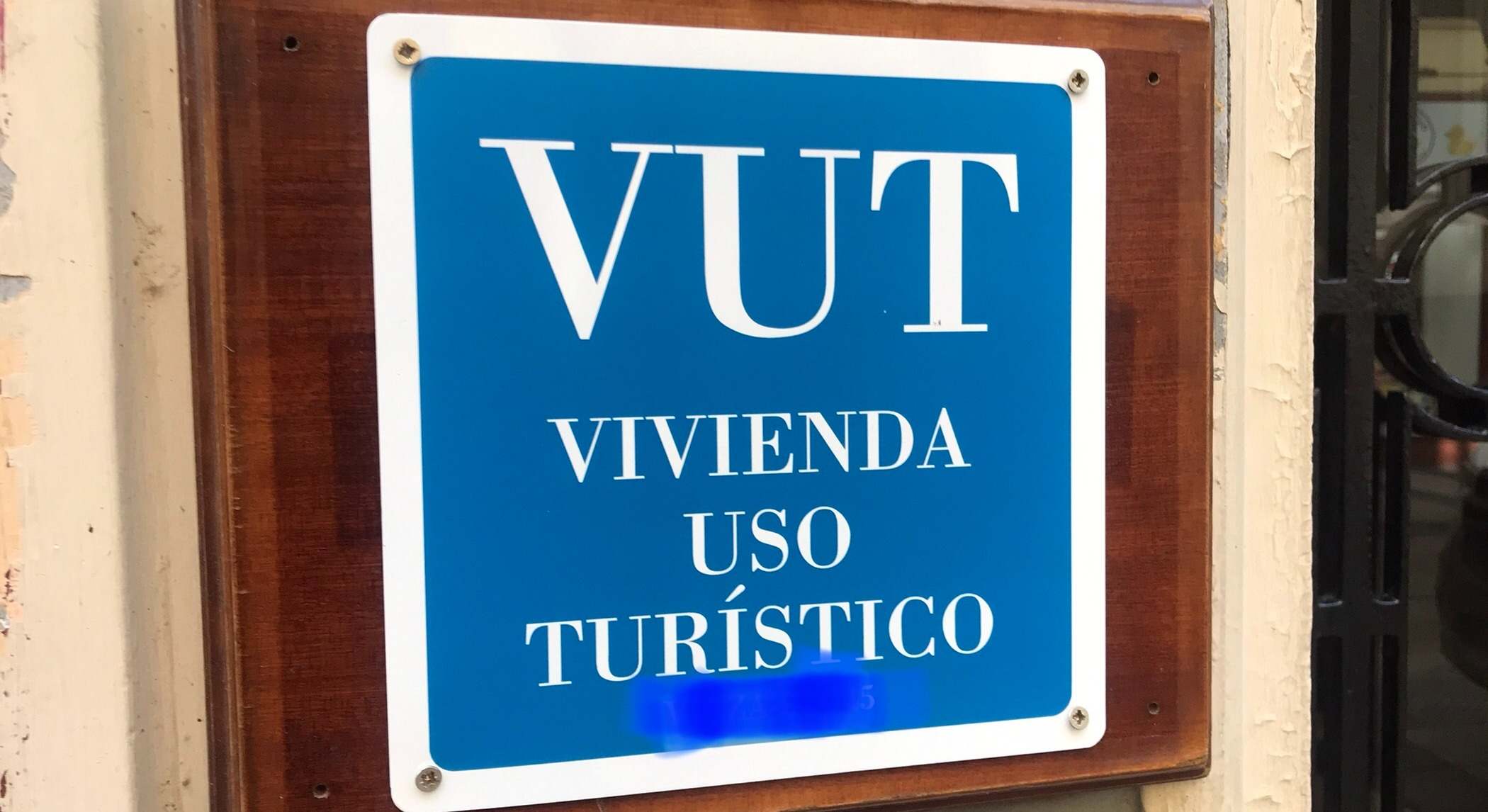 Cartel de vivienda de uso turístico