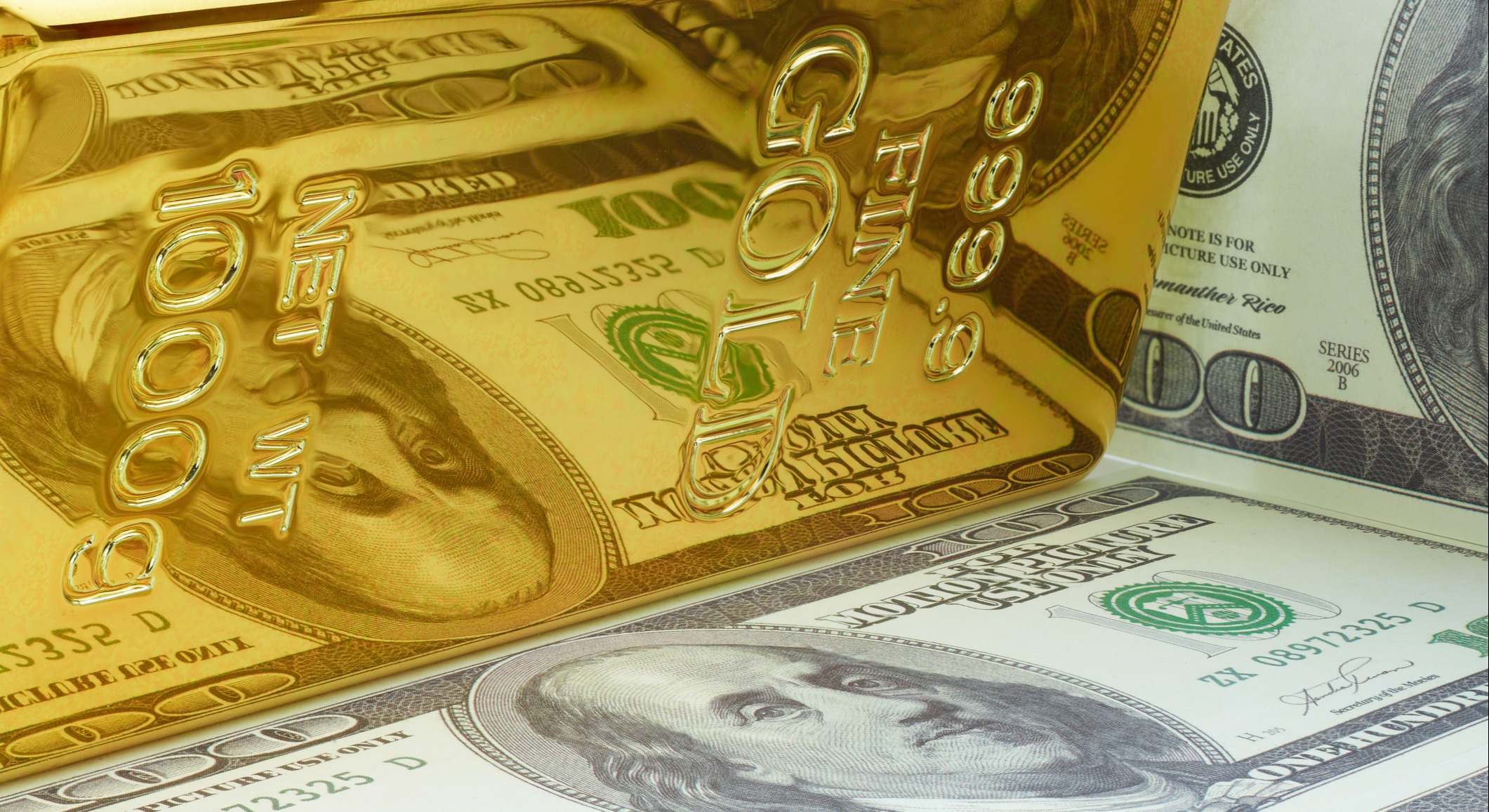 Oro y dólar (Dreamstime)