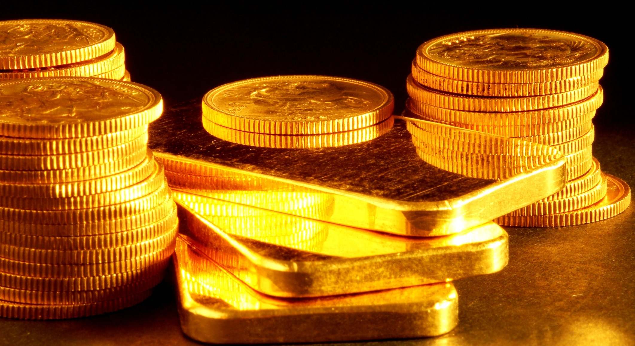 Monedas y lingotes de oro