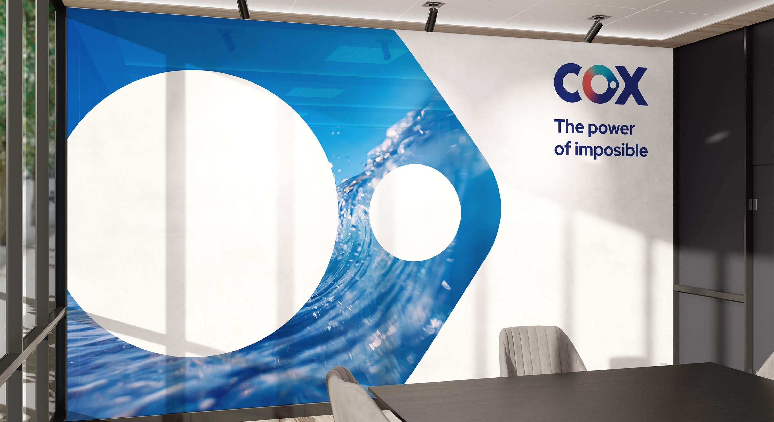 El nuevo logo de Cox. COX