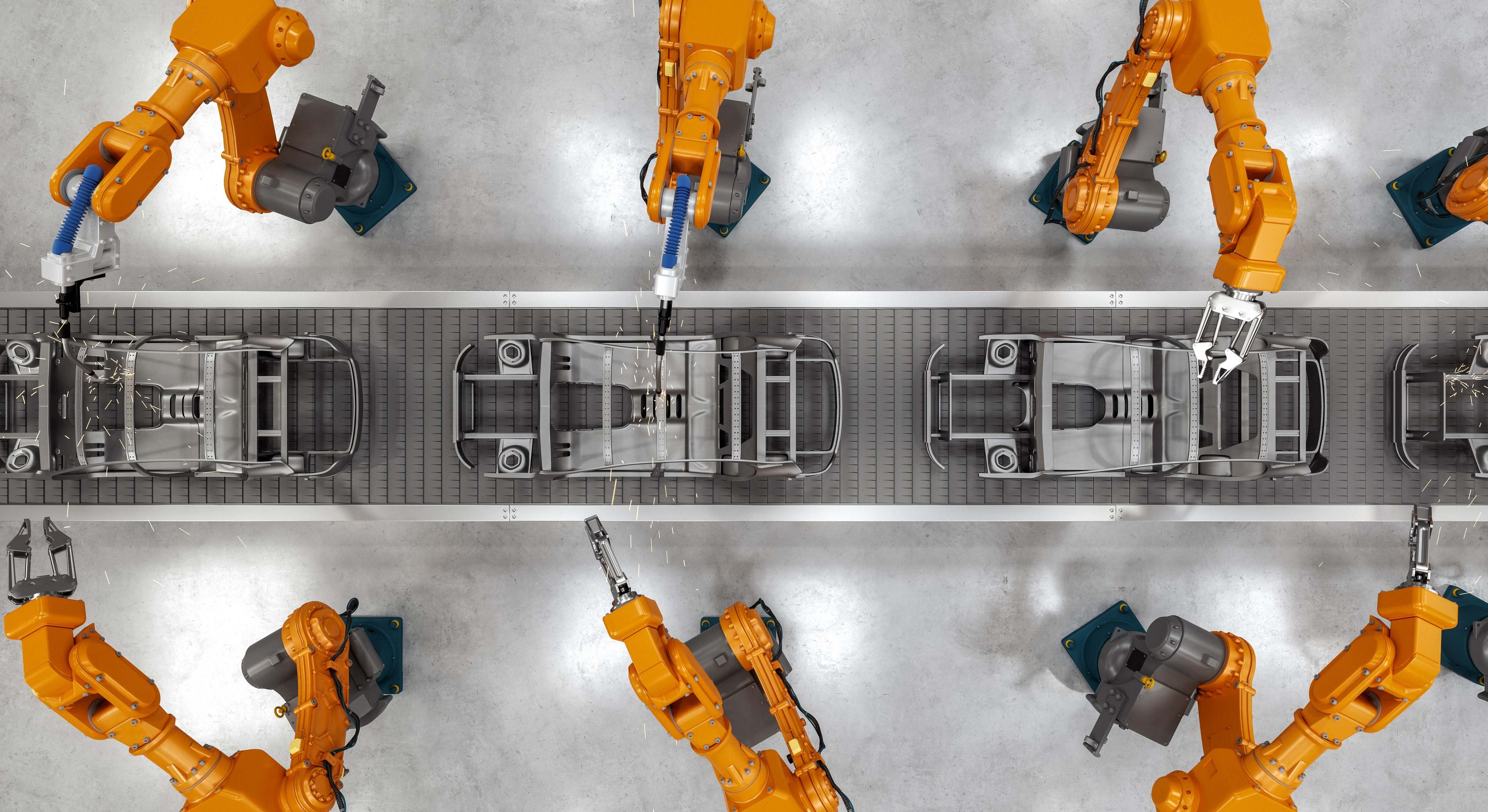 Robots industriales en la línea de montaje de un fábrica de automóviles