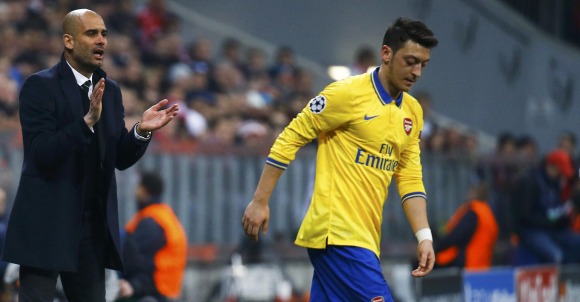 Guardiola-Ozil-2014-Reuters-champions.jpg