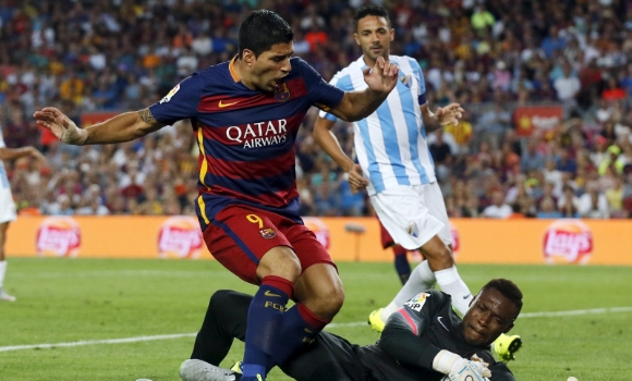 suarez-kameni-reuters.jpg