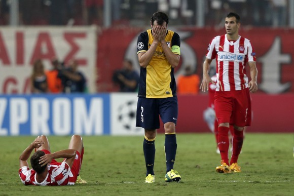 Godin-lamenta-2014-reuters-olympiakos.jpg