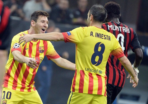 Messi-iniesta-celebran-milan-2013-reuters.jpg