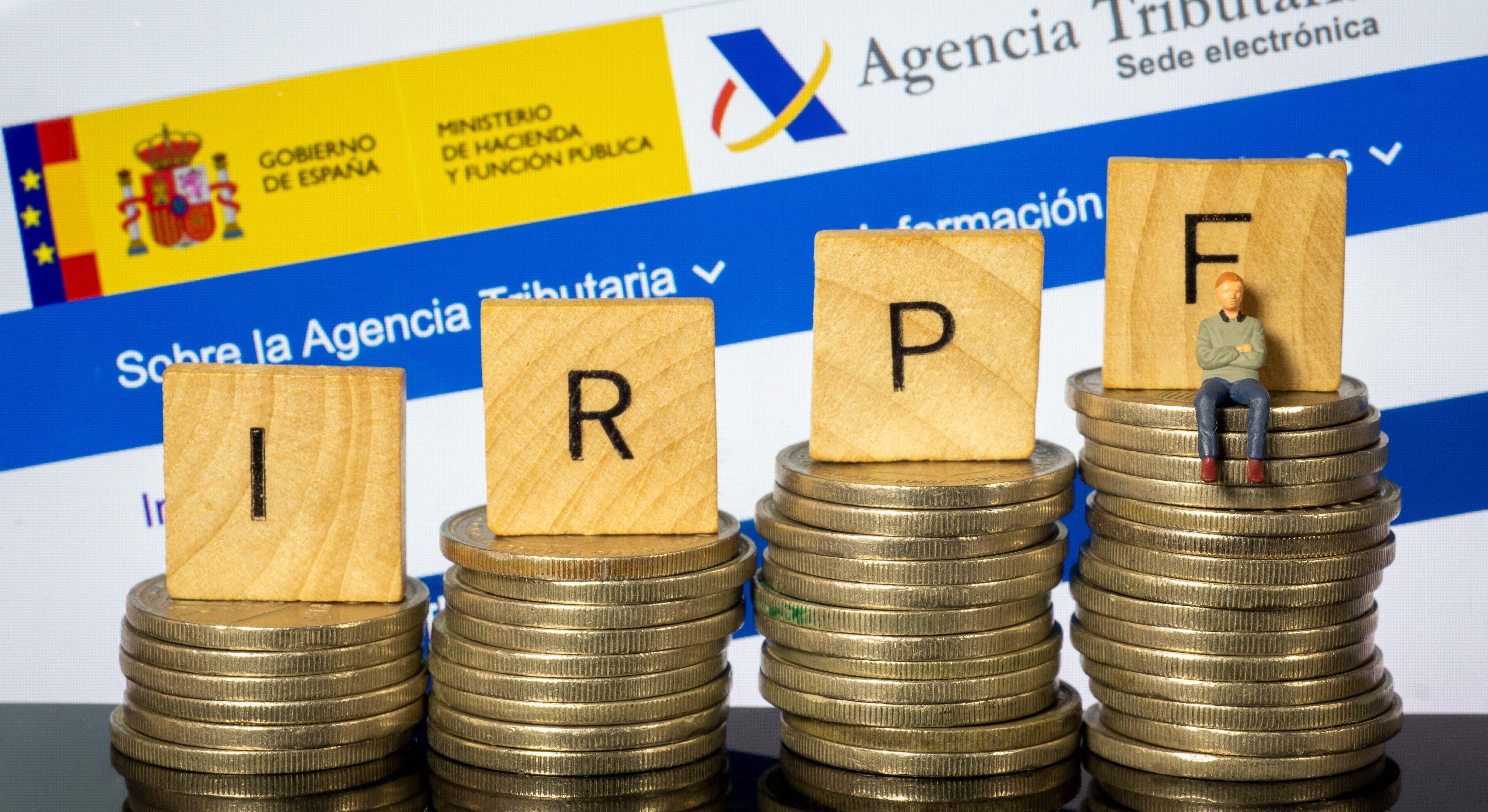 Monedas junto a la palabra IRPF