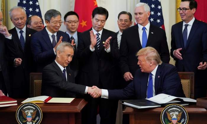 trump-firma-acuerdo-china-reuters-700x420.jpg