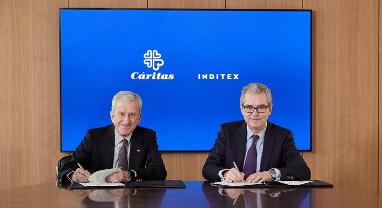 Los presidentes de Critas Manuel Bretn e Inditex Pablo Isla firman un acuerdo
