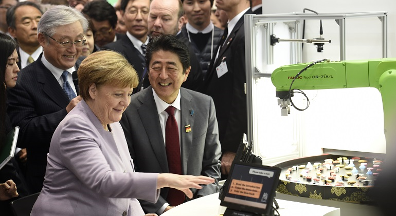 hitachi-merkel-abe-feria-reuters-770x420.png