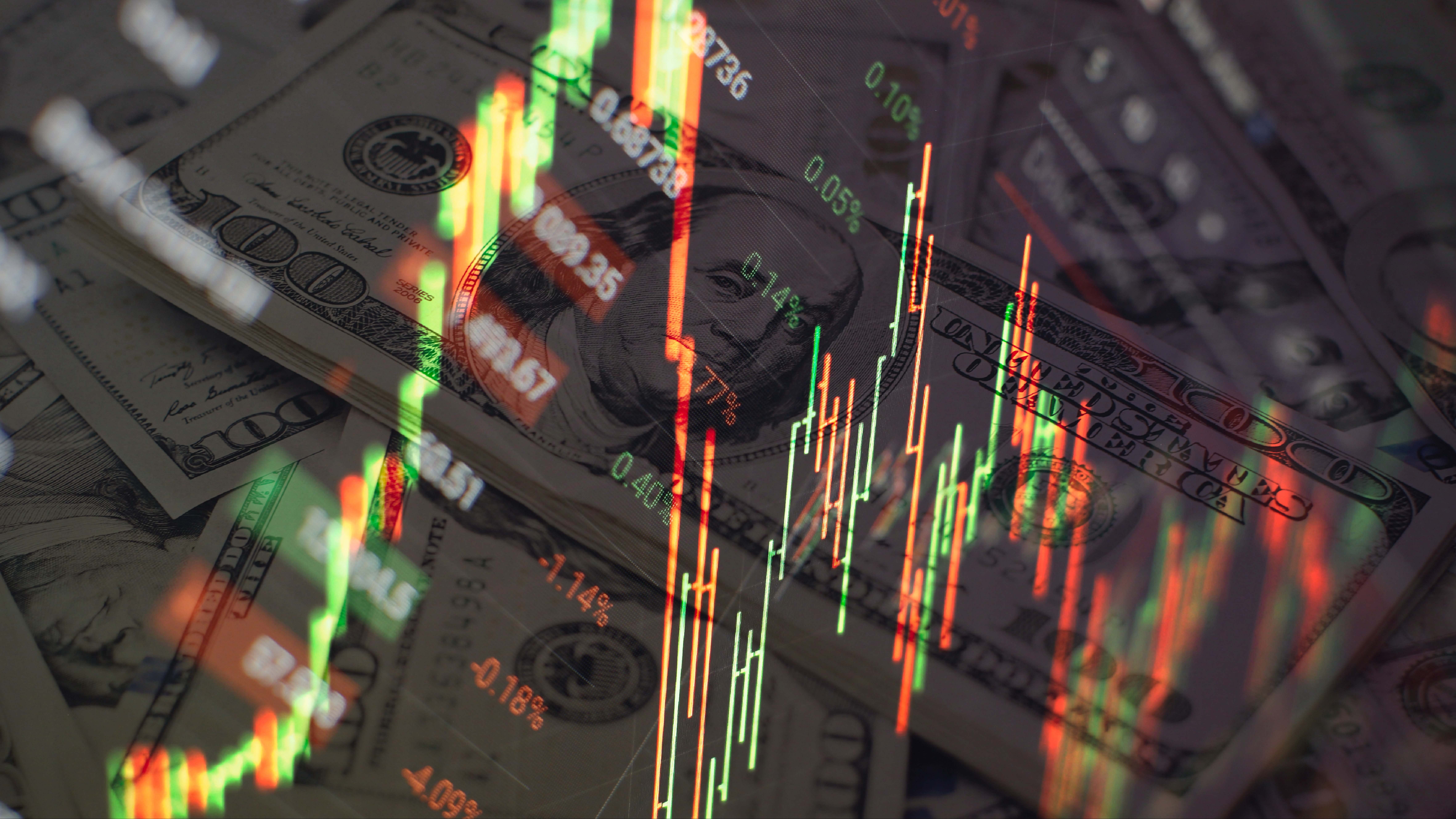 Charts de bolsa sobre un fondo de dólares