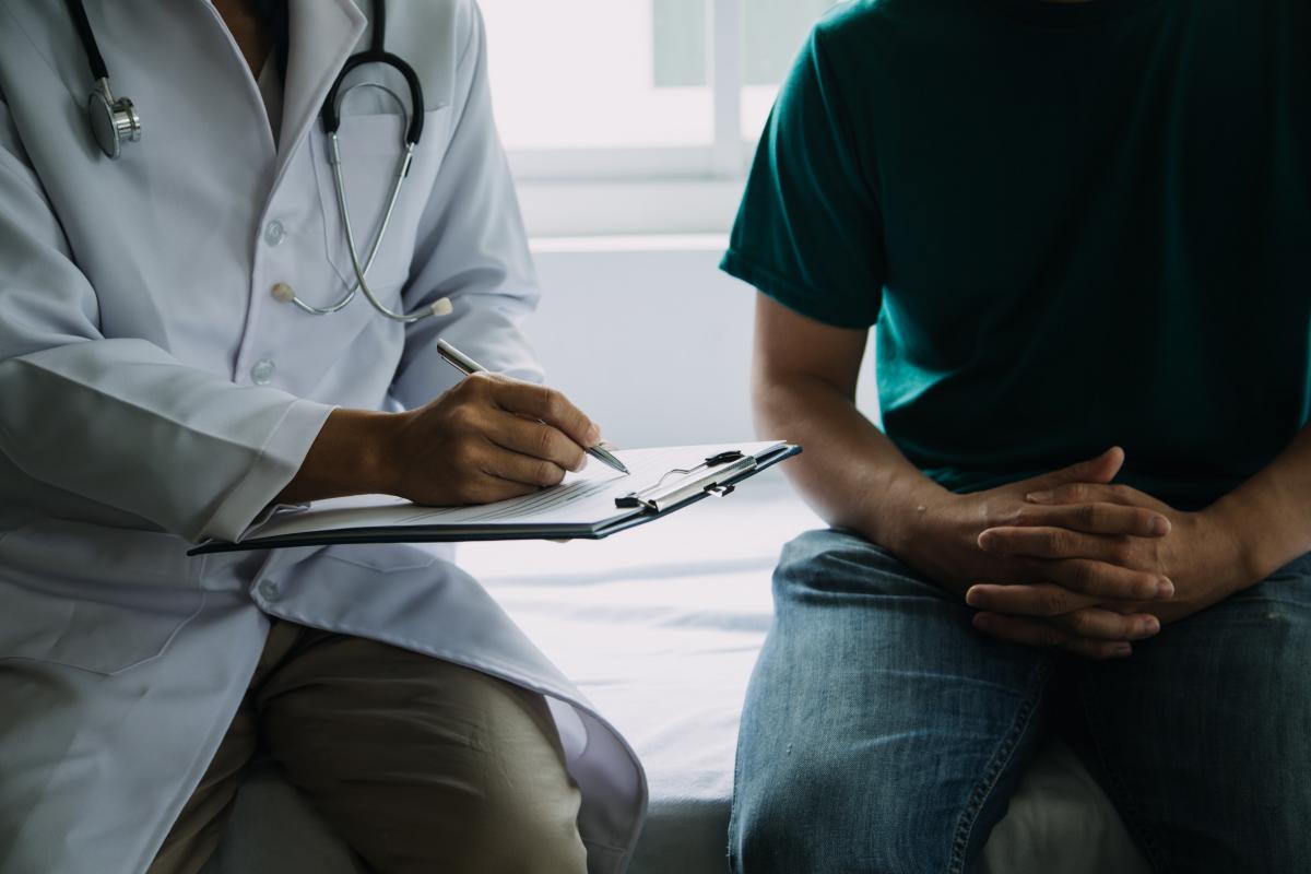 Médico y paciente | Foto de 123RF/armmypicca